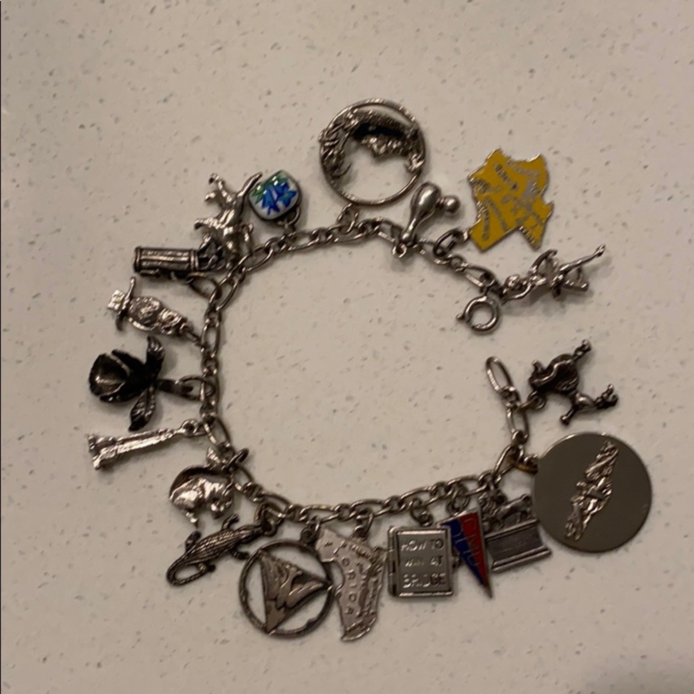 Vintage Sterling silver with 19 charms bracelet